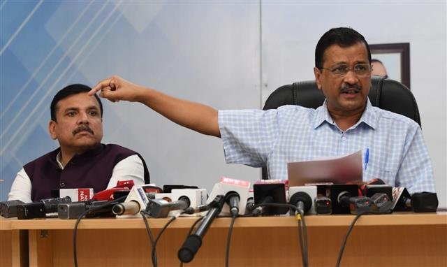 Sanjay Singh and Arvind Kejriwal