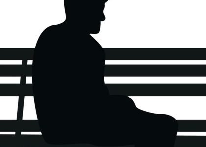 The man sit in park silhouette